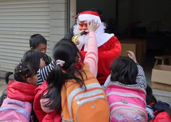 At least the kids are excited to see Santa.