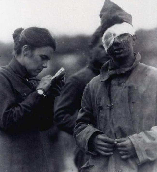 8.) Wounded soldier dictates a letter in 1917.