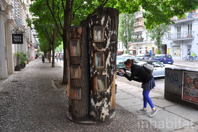 This cluster of trees in the middle of a sidewalk is called "The Berlin Book Forest."