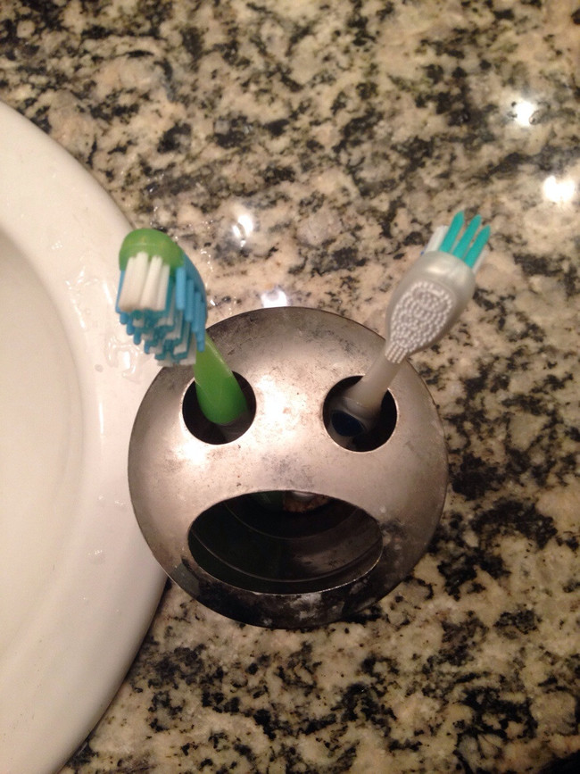 2. This toothbrush holder looks like a man getting his eyes gouged.