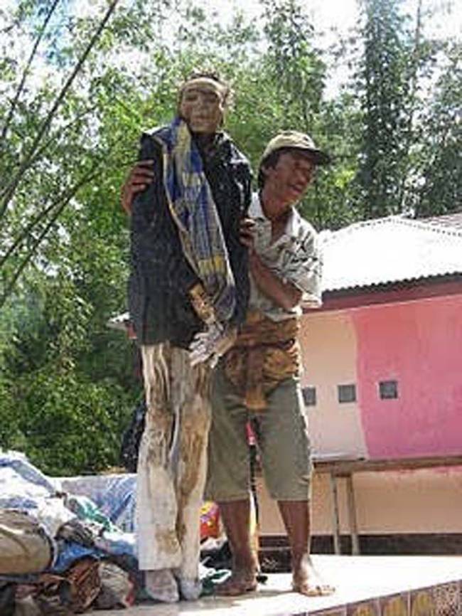 During the ceremony the dead are washed, groomed, and dressed in new clothes.