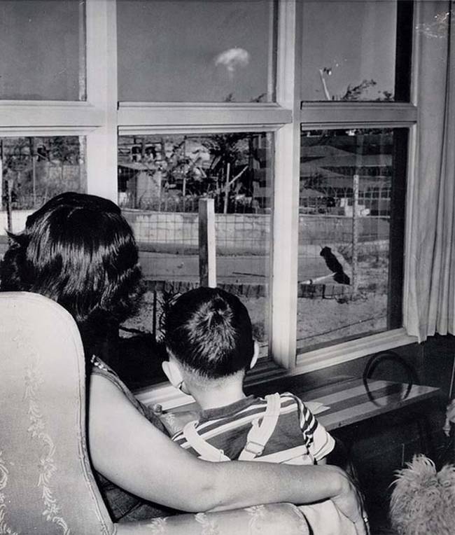 A mother in Las Vegas watching the mushroom cloud from atomic testing 75 miles away.