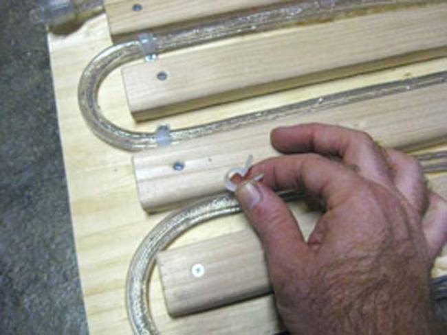 Attach the lights to the board using plastic cable clamps.