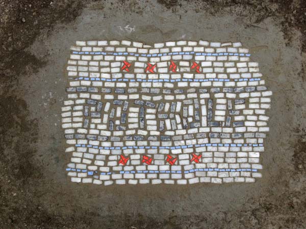 The mosaic tiles are a strange sight to see on the streets.