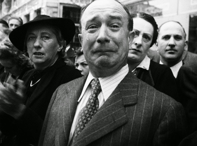 18.) A Frenchman cries during the Nazi occupation in 1940.