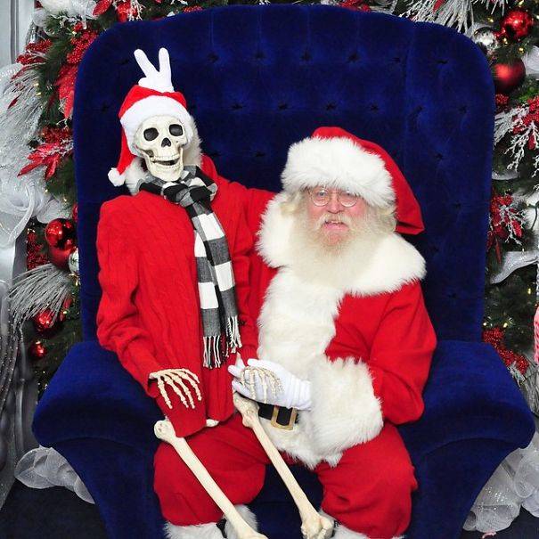 "LOL literally dying over my photo with #Santa! Trying to butter the big guy up so I get off the naughty list ;) Some kids were crying when I sat on his knee - what brats! Not like my wish list was THAT long."