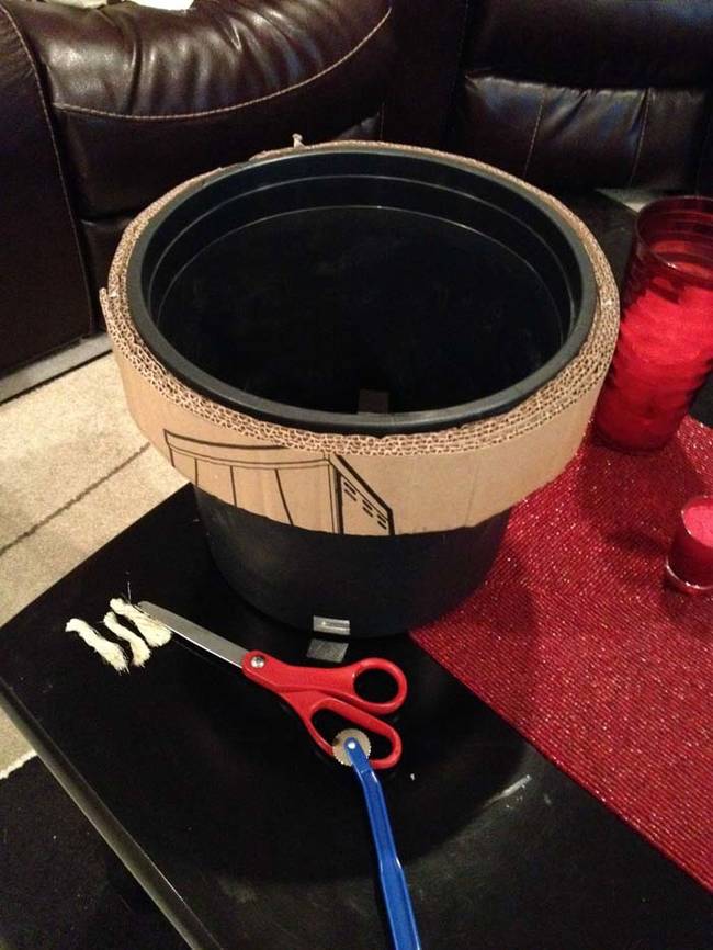 He put cardboard around the buckets, or the "tubes," to use as scratching posts.