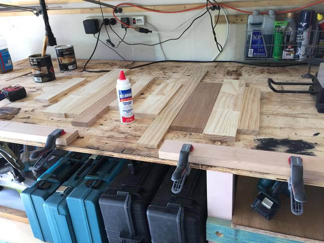 He then began assembling the various pieces of wood - the shelf was taking shape.