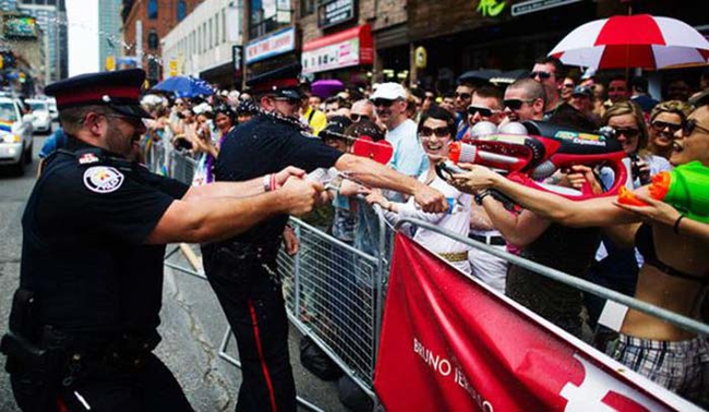 2.) Toronto officers having a watergun fight with supporters of the Toronto Pride March.