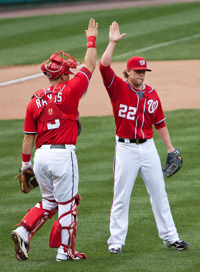 A high five consists of two people collaboratively applauding each other.