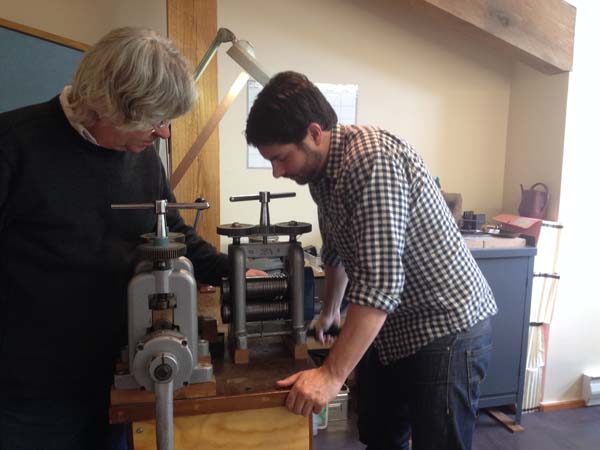 "The ingot begins the slow process of getting stretched and squished. Essentially it goes through a series of industrial strength pasta presses - one to "square" the ingot (pictured here) and then another to flatten the metal to the approximate width/thickness."