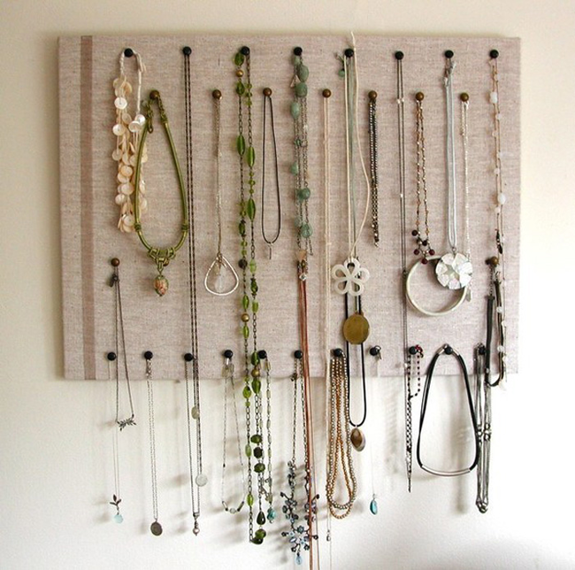 8.) Use fabric over a cork board and some push pins to organize your necklaces.