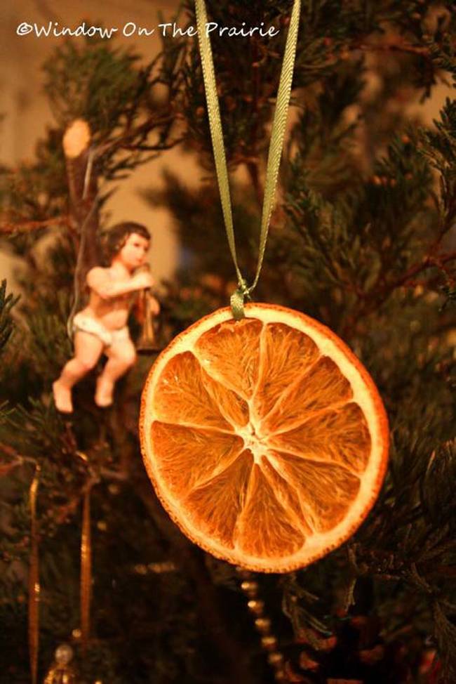 Hanging dried oranges on the tree is a tradition for many families.