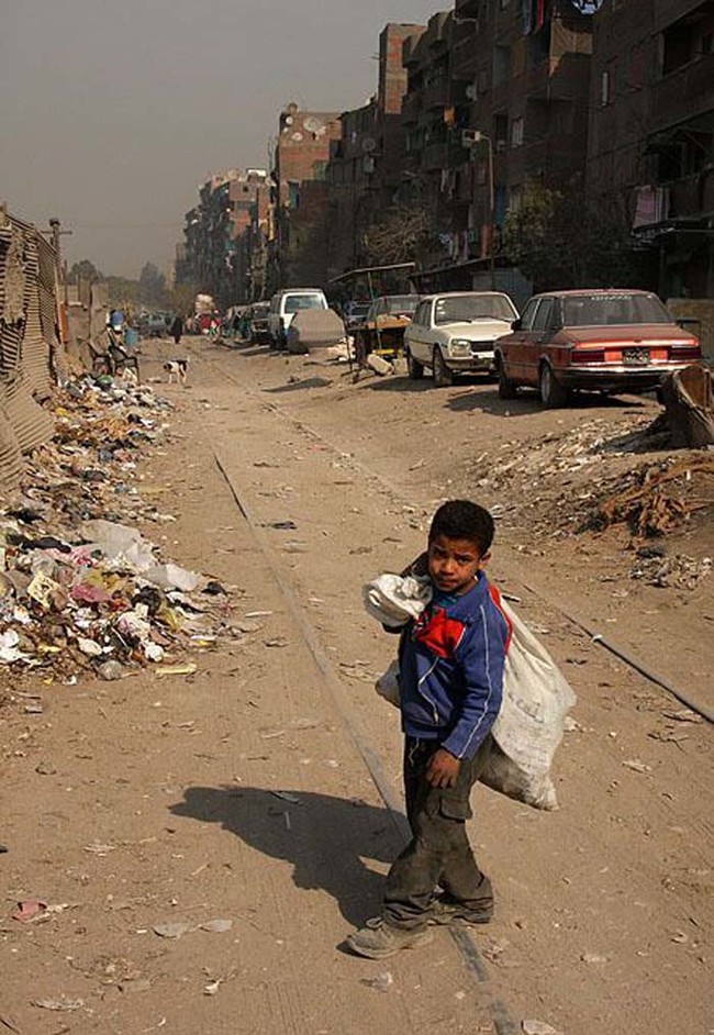 The children of Medina Zabbaleen learn to spot pieces of plastic, cotton, metal, and iron within the heaps of garbage from a very young age. These are valuable materials that can sold for profit.