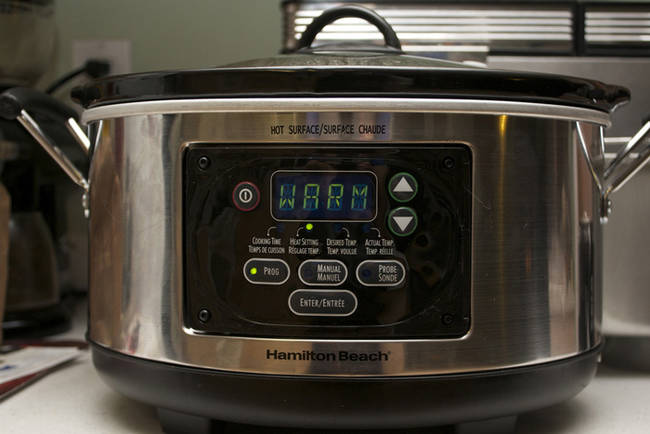 Keep your potatoes and other potted dishes warm in a crock pot set on low.