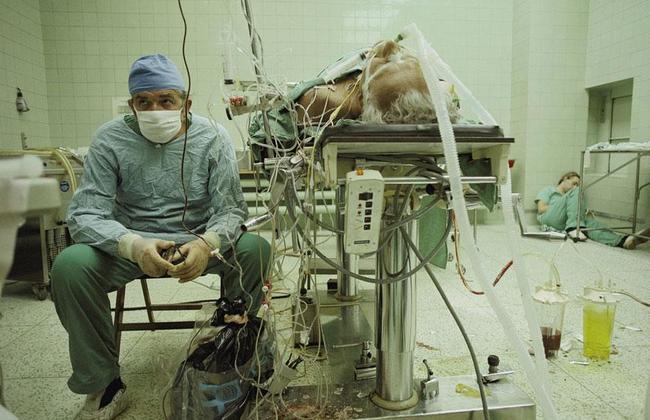 20. Relief - Heart surgeon after 23-hour-long (successful) heart transplant. His assistant is sleeping in the corner.