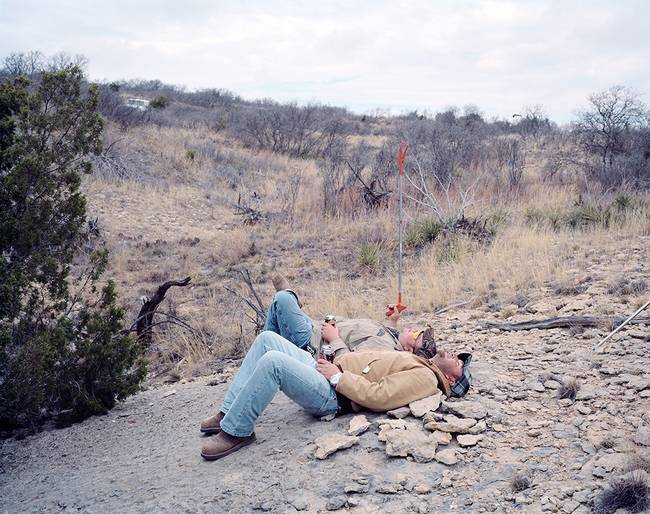 The men spend hours out hunting, so it's understandable that they need to take a break every once in a while. Hopefully, they double-checked to make sure there weren't any snakes nearby...