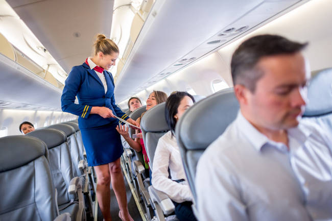 Tip your flight attendant to ensure that you'll have first-class service no matter where you sit.