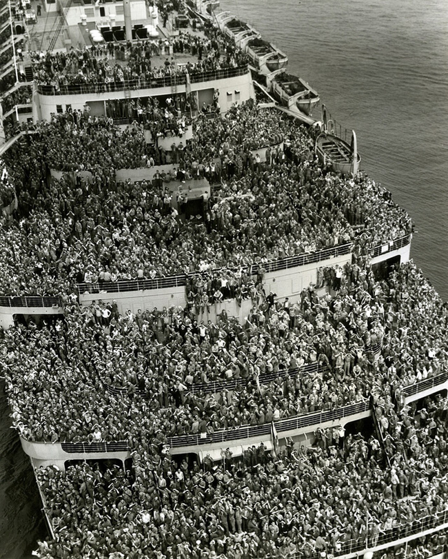 6.) The crowded and happy ship bringing back troops to New York harbor after V-Day in 1945.