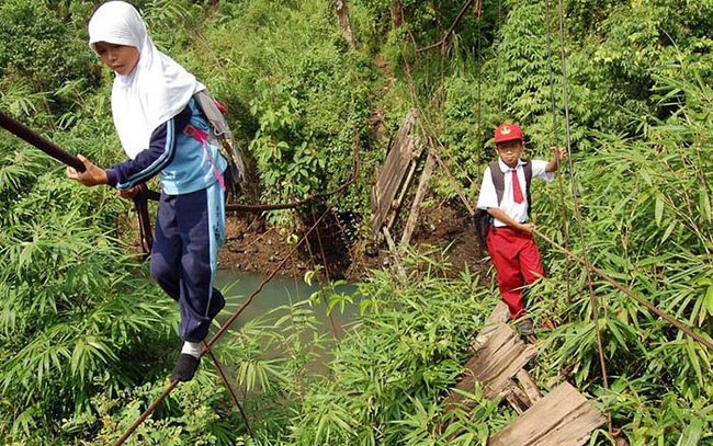 1.) Sumatra, Indonesia - Walking a tightrope suspended 30 feet above a raging river.