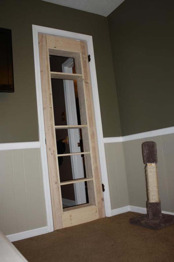 He built the door frame and then a separate shelving insert. He used screws and glue on the inside of the shelving to secure it to the frame.