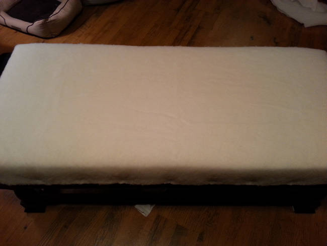 Multiple layers of foam were covered with batting and attached to the ottoman. Then, it was time for the upholstery.