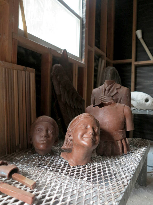 The children, awaiting bronzing, at the foundry. Bronze statues are formed and bronzed in pieces, and then welded together.