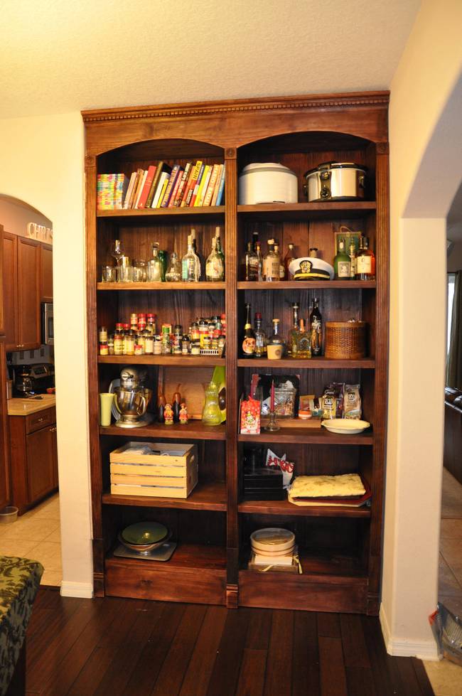 Looks like a normal cabinet right? Wrong. This happens to be the location of one man's secret stash of scotch. Sure he's got a couple bottles on display, but that's not the <em>good</em> stuff.