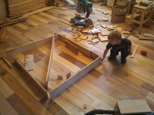 Luckily, everyone had their role. This little guy offered a little respite for the family to play with some of the pieces of wood.