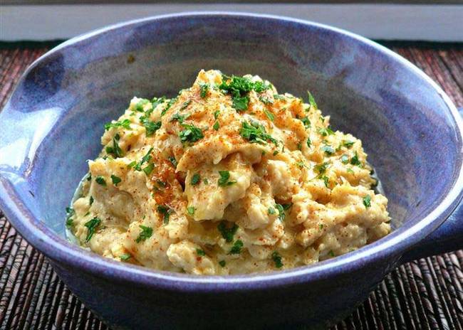 Jazz up plain hummus with authentic Greek touches like olive oil, feta cheese, and paprika. Check out more tasty hummus ideas from <a href="https://tianguyen.blogspot.ca/2008/08/garlic-love-roasted-garlic-hummus.html">Tia Nguyen</a>.