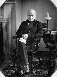 9.) A photograph of John Quincy Adams.