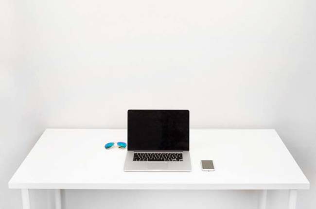 Ahh... modern 2014 desks. No clutter, just a laptop and a smart phone. The only thing missing a giant cup of organic, fair trade coffee.