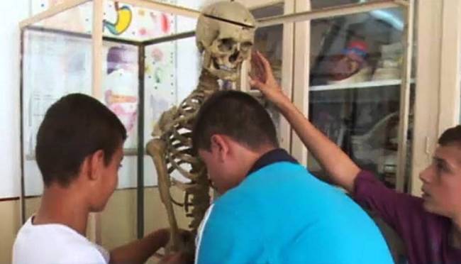 A headmaster and former science teacher in Romania loved his classroom so much, he stayed there, even in death.