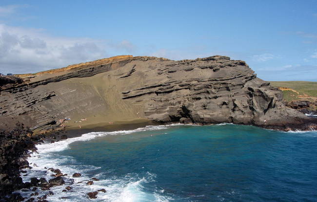 Papakolea Beach may look normal at first.