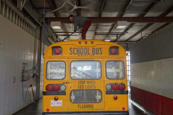 "The moose's first bath. 5 days before we leave for Coachella and still not painted. Leaving the bus yellow just wasn't an option since it is illegal in most states in the US to have a private school bus that color."