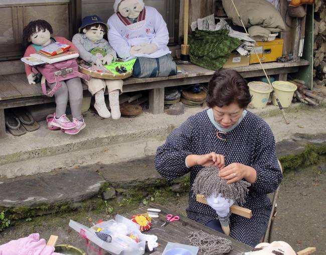 Ayano says there are now over 100 friendly scarecrows hustling and bustling around the mostly abandoned town.