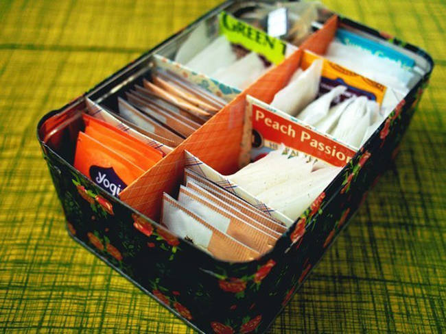 20.) Use an old tea tin and scrapbook paper for easy access to all your tea.