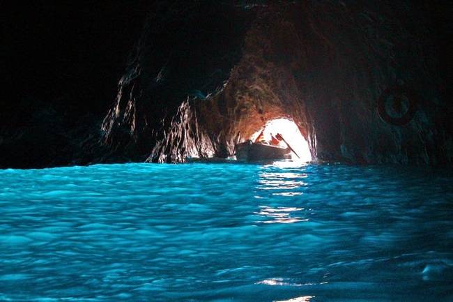 The grotto is famous for its otherworldly blue glowing waters. Its fluorescent glow comes from a large underwater cave opening, which illuminates the grotto's water from below.