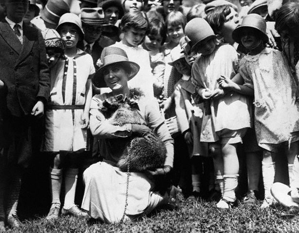 5.) First Lady Coolidge and her pet raccoon.