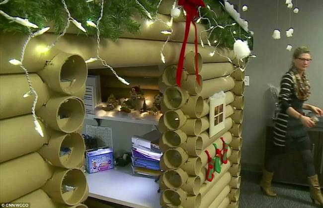 She then took to decorating the log cabin to make it nice and festive. She used fake snow, mini stockings, wreaths, twinkle lights, and even set up a cute snowman scene inside.