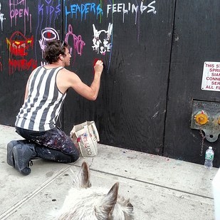 Artist Greg Siff, paints Elmo's portrait.