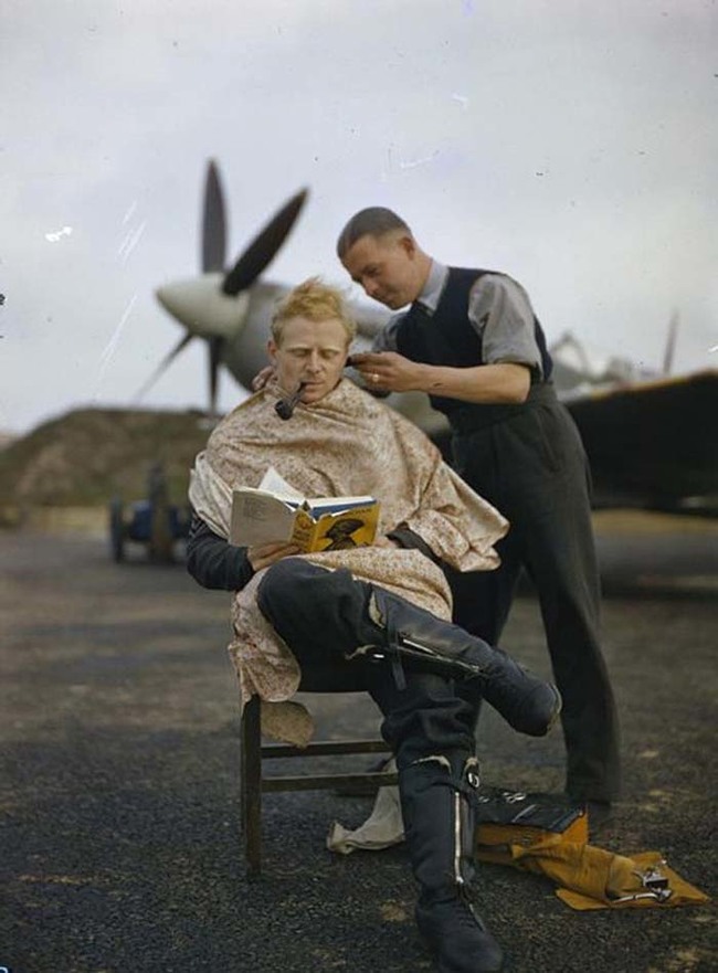 33.) An RAF Pilot getting a haircut during a break between missions, Britain (1942).