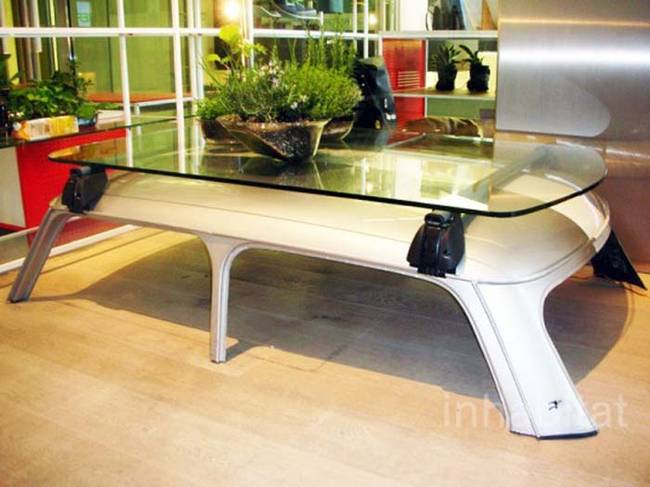 4.) This table is made out of a car's roof and a sheet of glass.