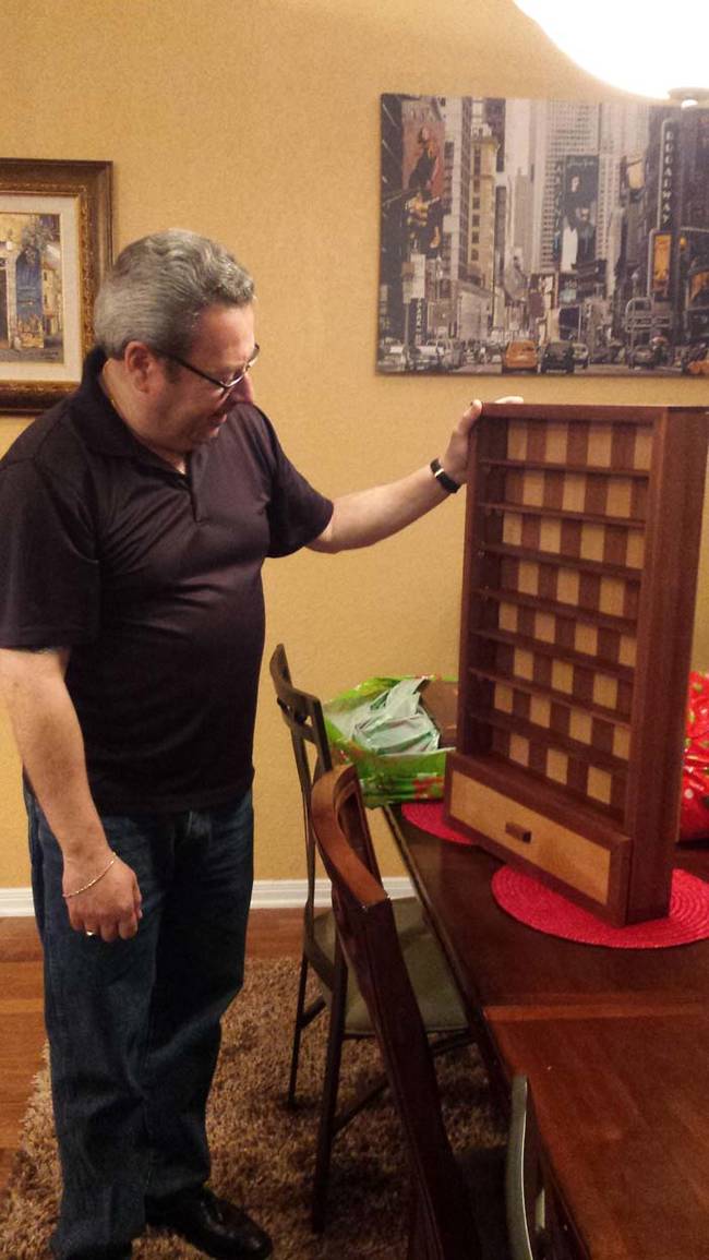 Once the shelves were installed, he gave it to his father as a gift.