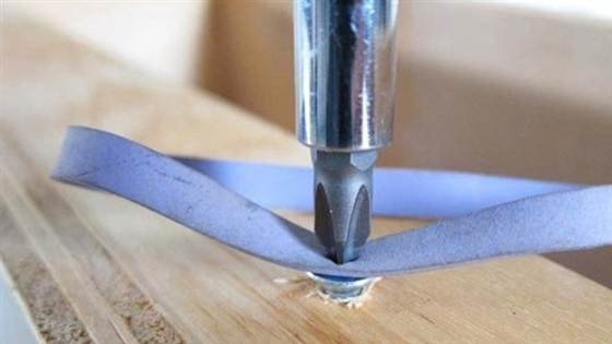 Remove a stripped screw with a rubber band.