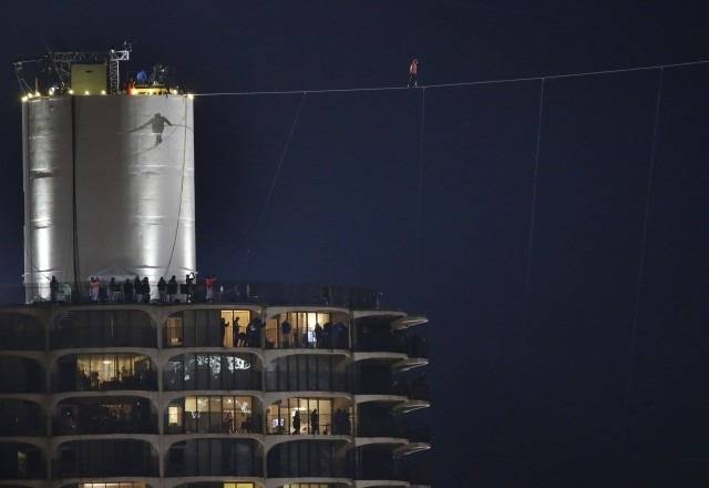 People in the Marina City towers watch anxiously.