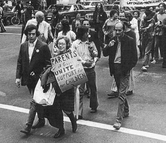 24.) Jeanne Manford marching with her song during the 1972 New York City Gay Pride Parade.