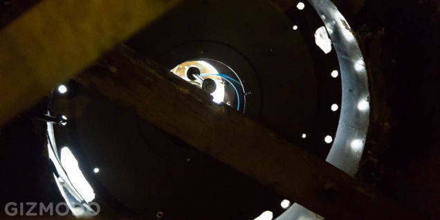 The clock from below, with sunlight pouring in through the gears.