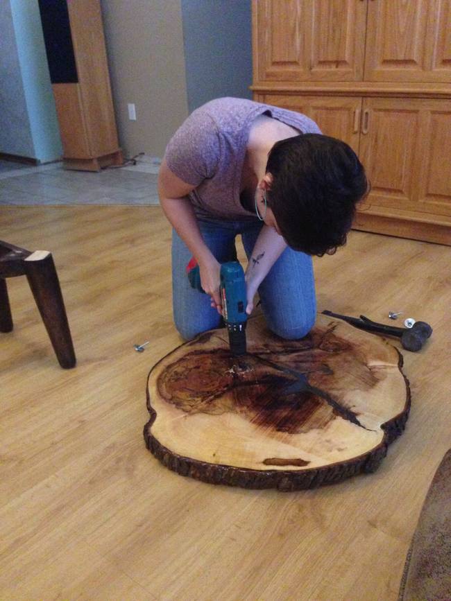 Here's his daughter doing her part in the last steps of putting the table together.