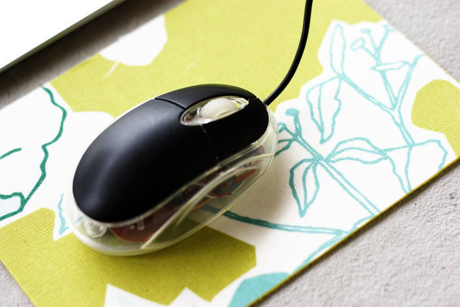 13.) Grab some swatches of cheap raw fabric for <a href="https://www.morningcreativity.com/diy-mousepad/" target="_blank">a cute and easy mousepad</a>.